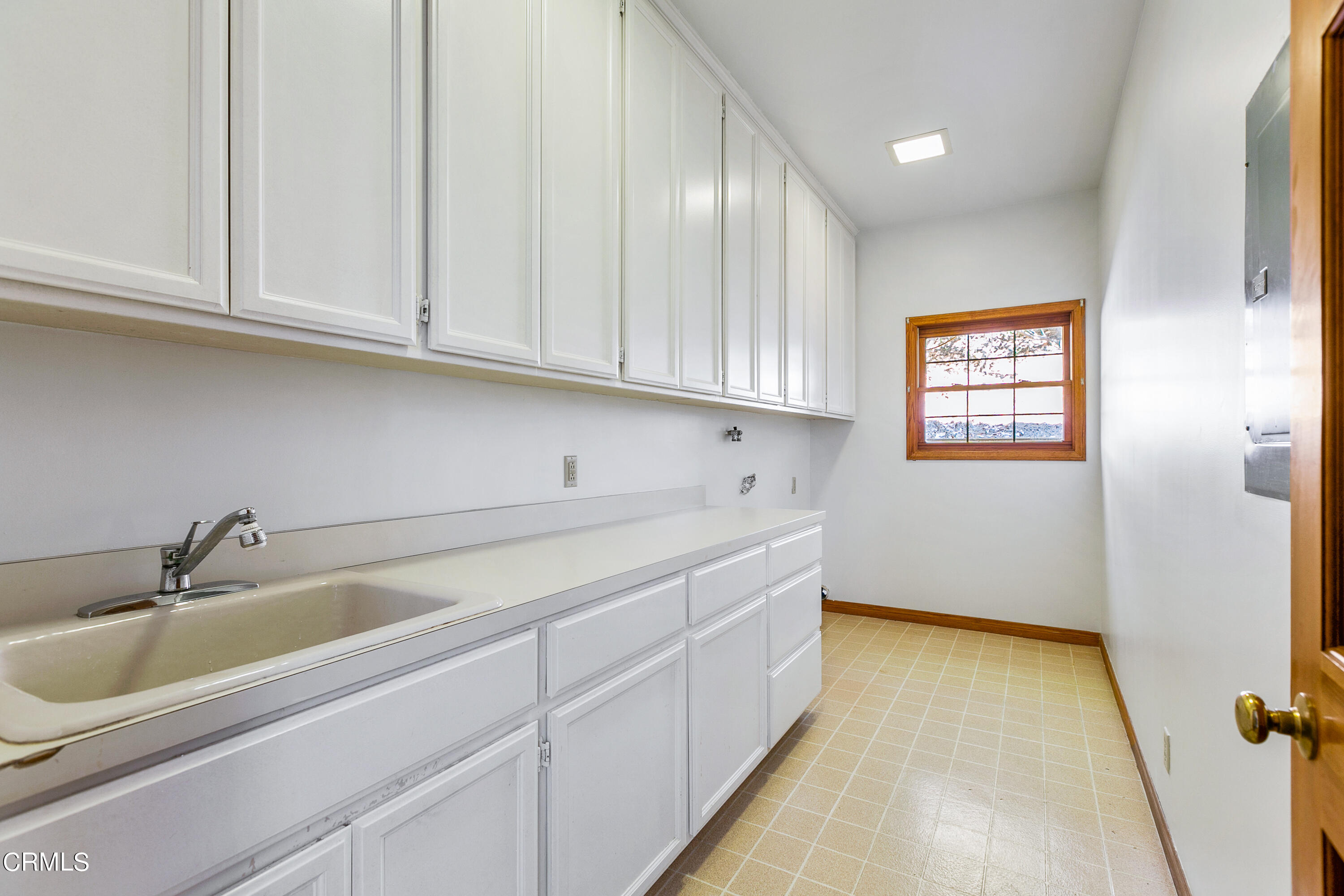 800 Greenridge Drive La Canada Flintridge, CA 91011 - Photo 29 of 58 a kitchen with a sink and cabinets