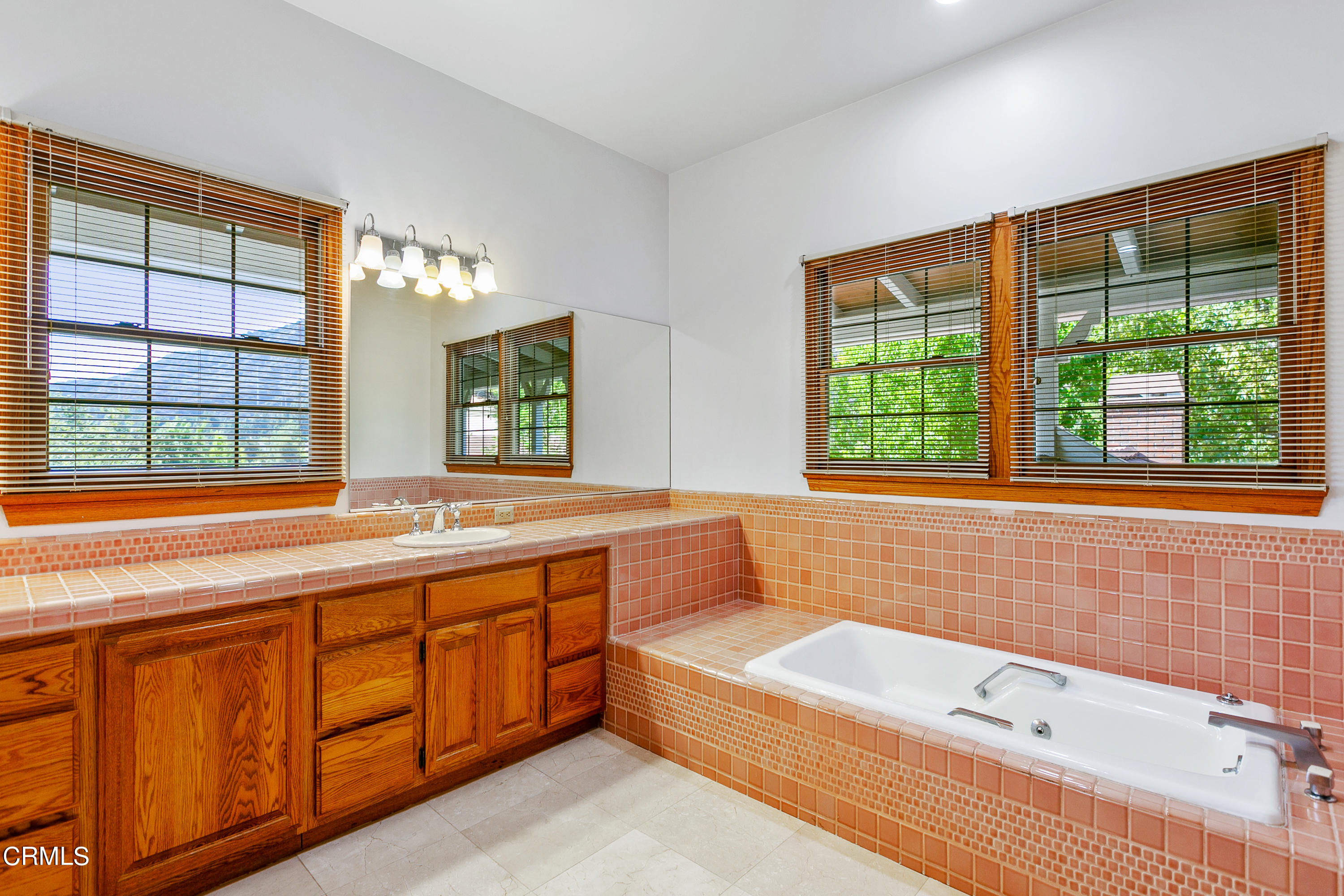 800 Greenridge Drive La Canada Flintridge, CA 91011 - Photo 37 of 58 a bathroom with a large tub a sink and a large window