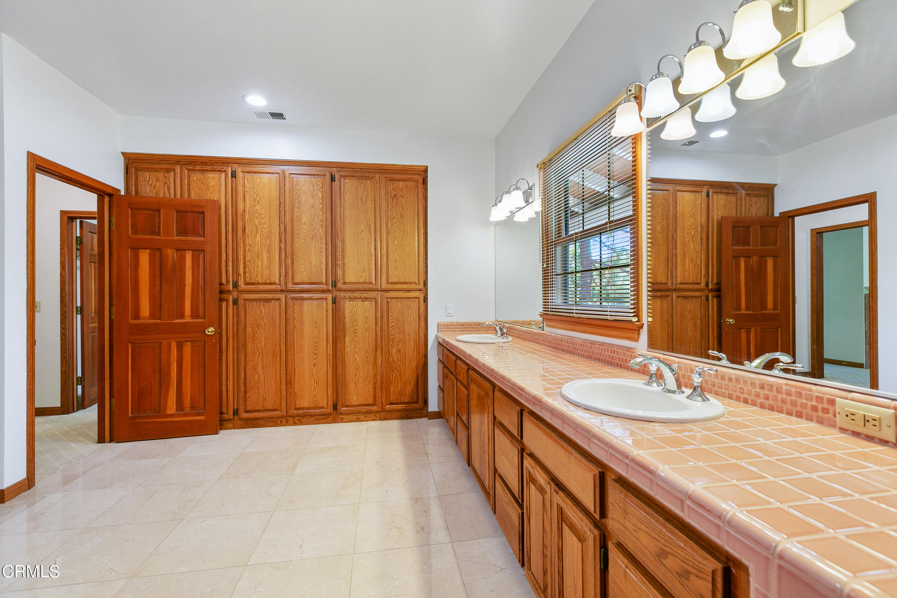 800 Greenridge Drive La Canada Flintridge, CA 91011 - Photo 39 of 58 a bathroom with a granite countertop sink and a mirror