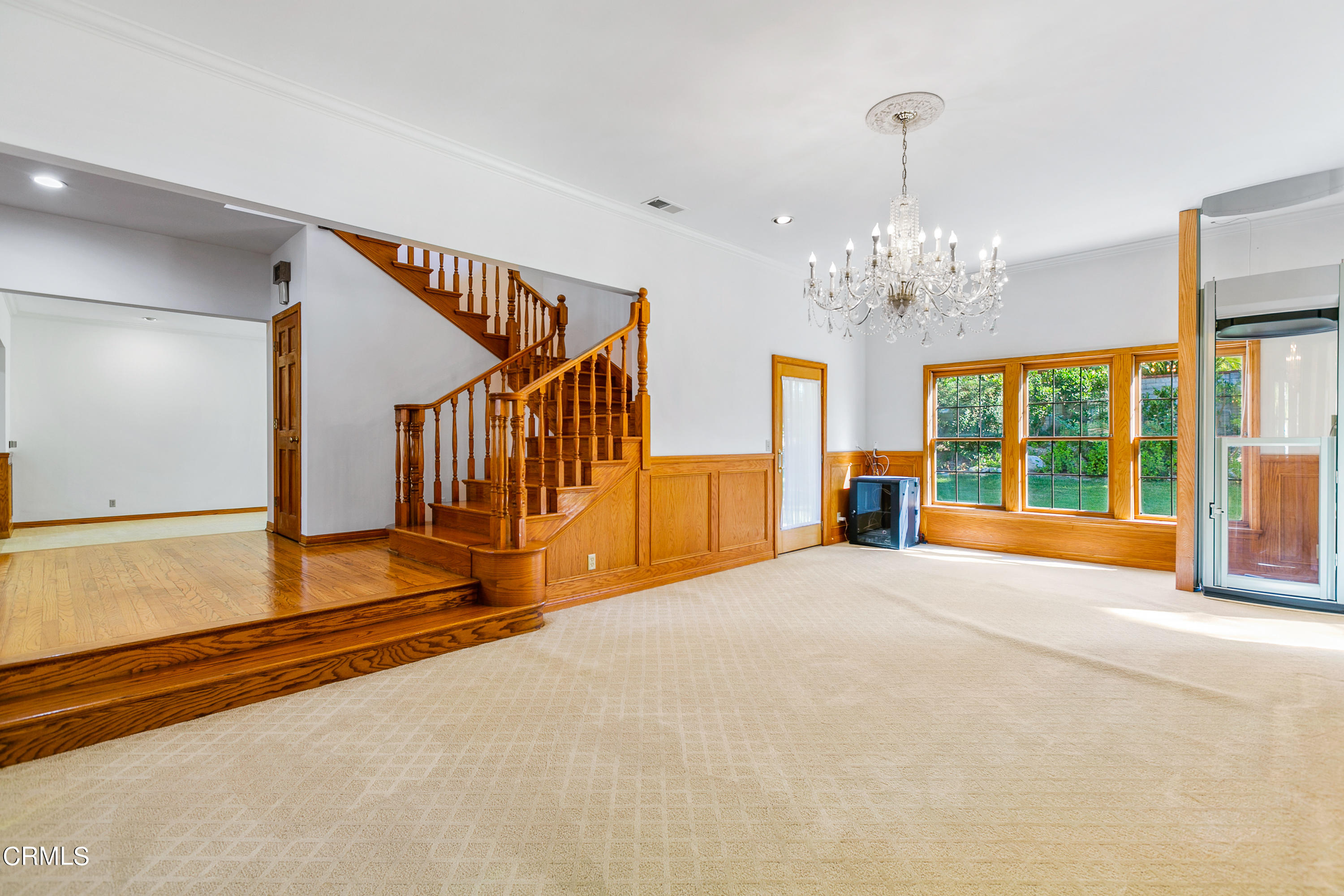 800 Greenridge Drive La Canada Flintridge, CA 91011 - Photo 10 of 58 a view of an empty room with chandelier and windows