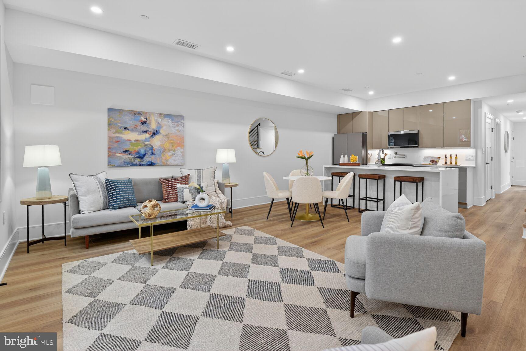 a living room with lots of furniture and a rug