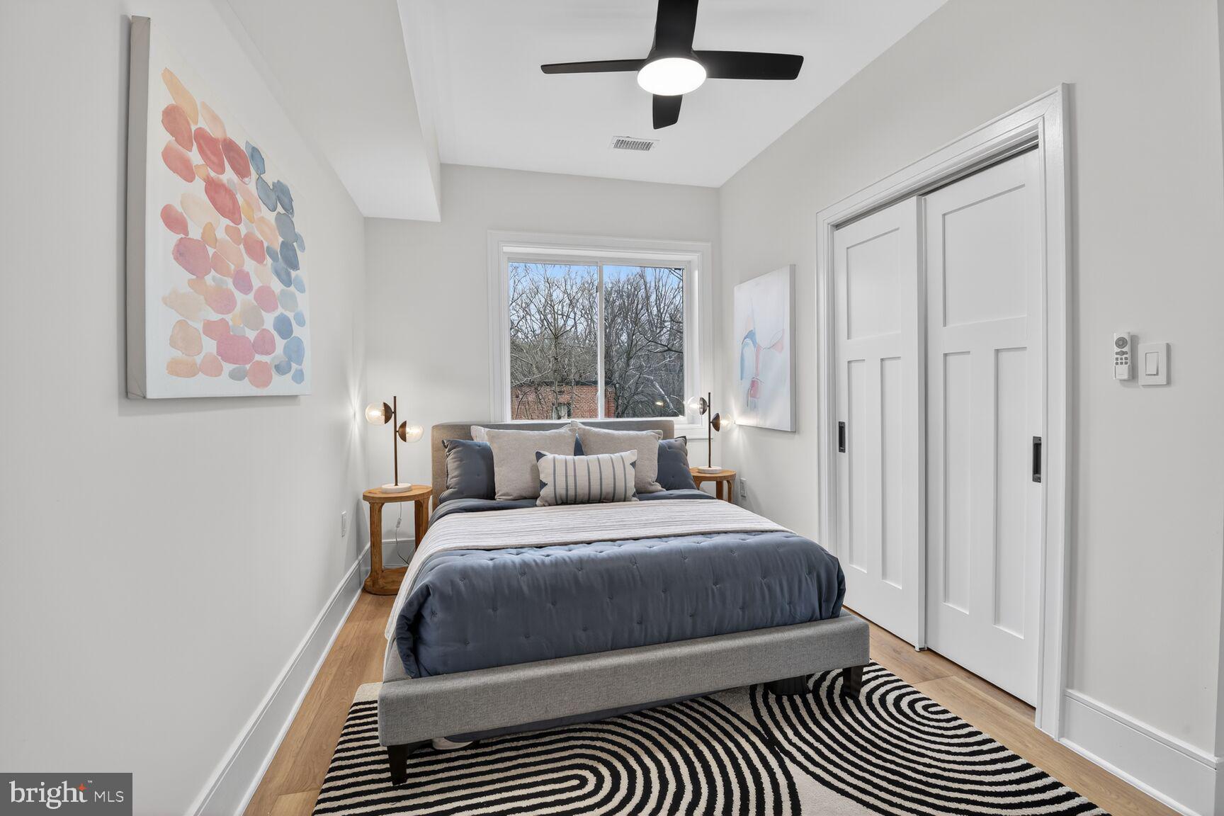 2524 41st Street Northwest, Unit 2 Washington, DC 20007 - Photo 12 of 27 a bedroom with a bed and a window