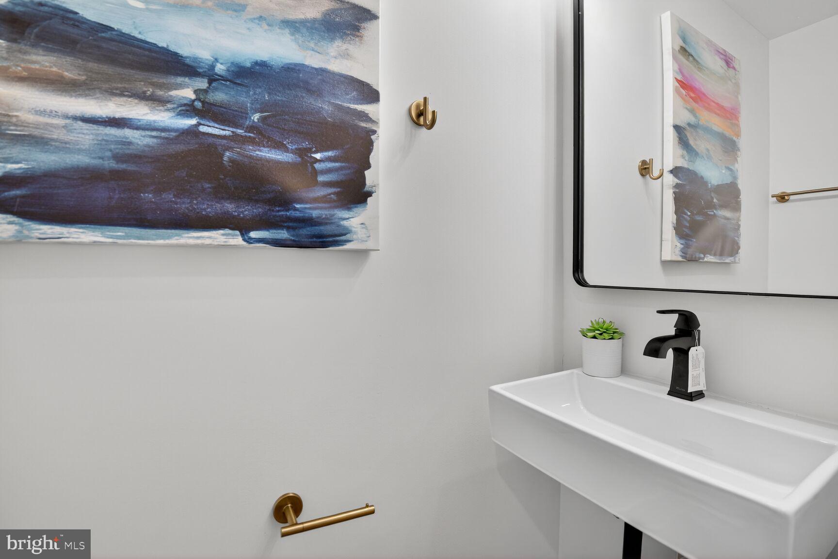 2524 41st Street Northwest, Unit 2 Washington, DC 20007 - Photo 13 of 27 a bathroom with a sink and a mirror