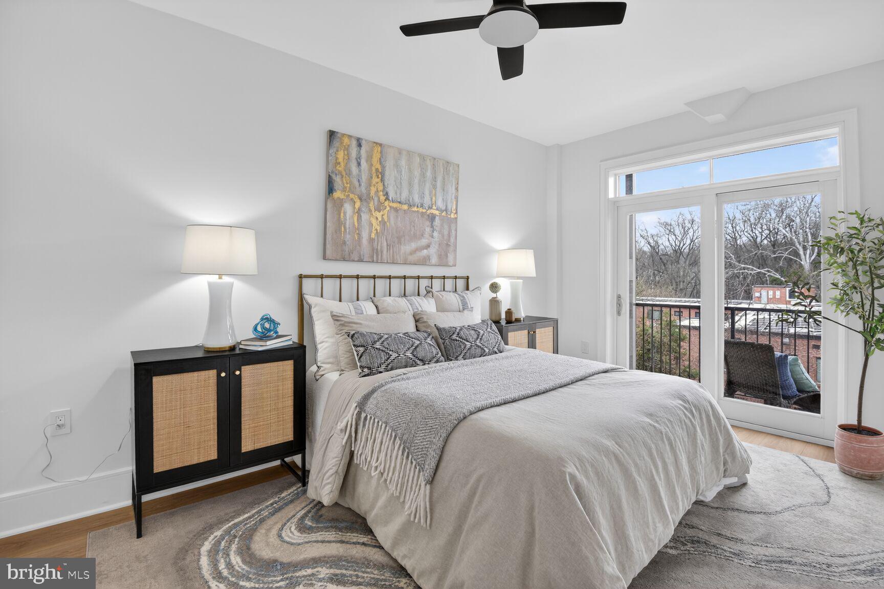 2524 41st Street Northwest, Unit 2 Washington, DC 20007 - Photo 17 of 27 a bedroom with a bed and a large window