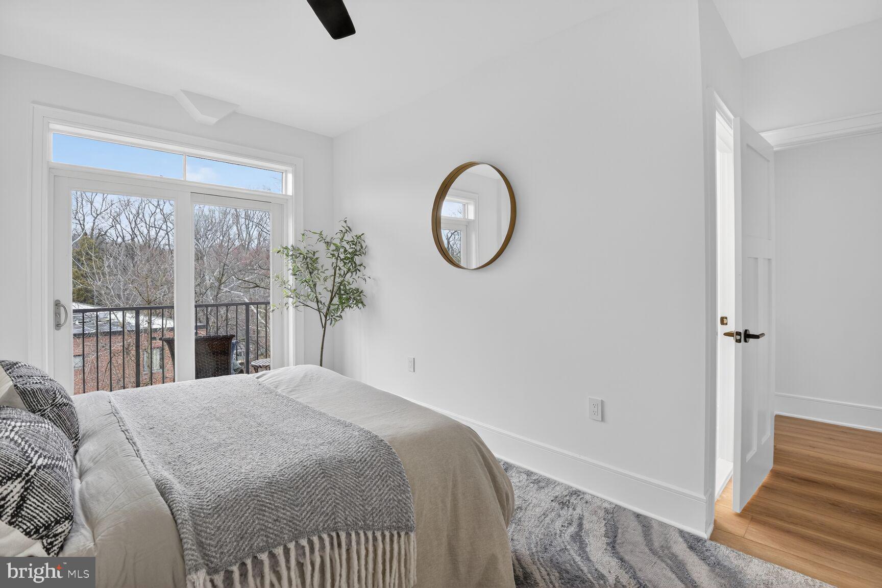 2524 41st Street Northwest, Unit 2 Washington, DC 20007 - Photo 18 of 27 a bed sitting in a bedroom next to a window