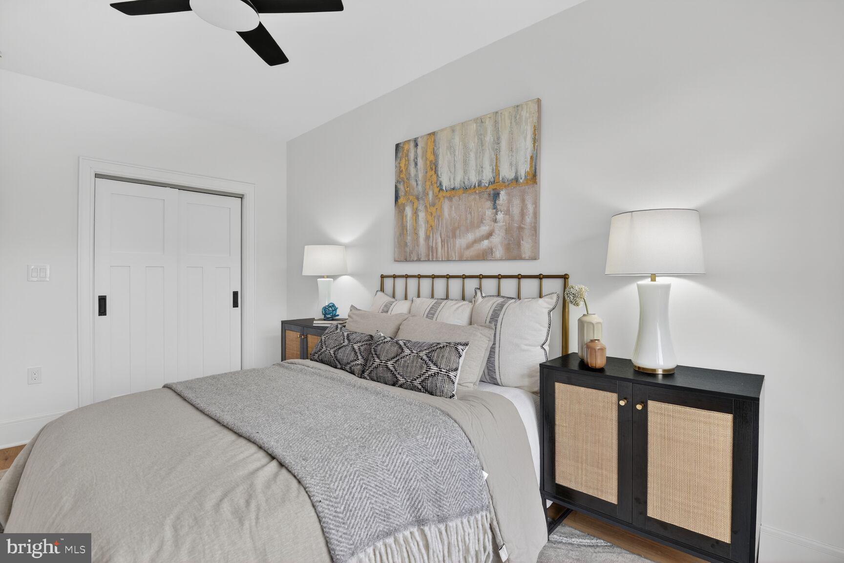 2524 41st Street Northwest, Unit 2 Washington, DC 20007 - Photo 20 of 27 a bedroom with a bed and a night stand