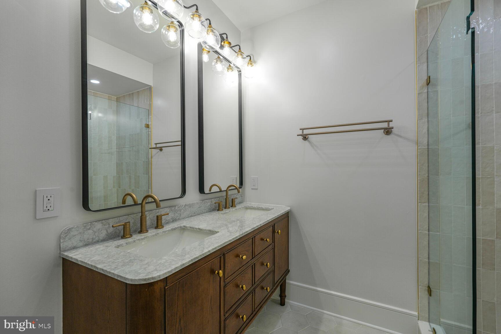 2524 41st Street Northwest, Unit 2 Washington, DC 20007 - Photo 20 of 25 a bathroom with a sink and a mirror