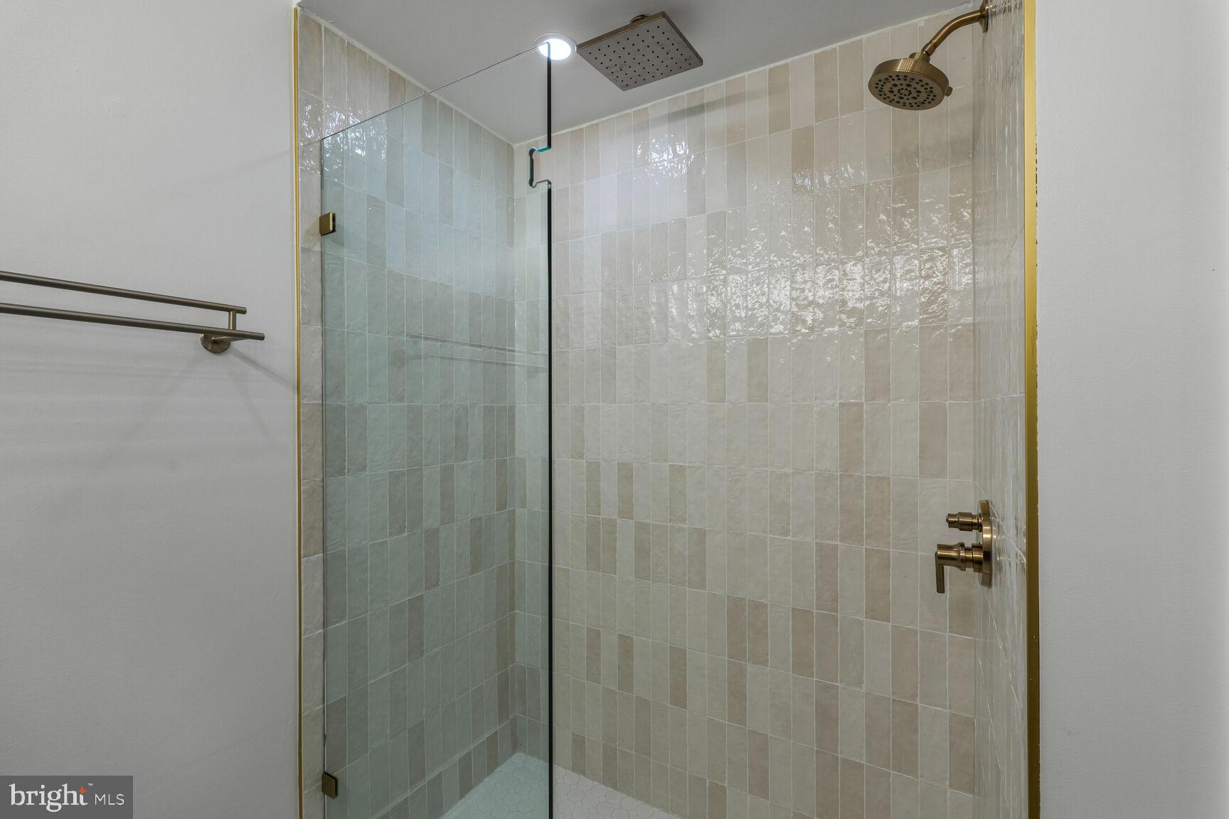 2524 41st Street Northwest, Unit 2 Washington, DC 20007 - Photo 21 of 25 a bathroom with a glass shower door