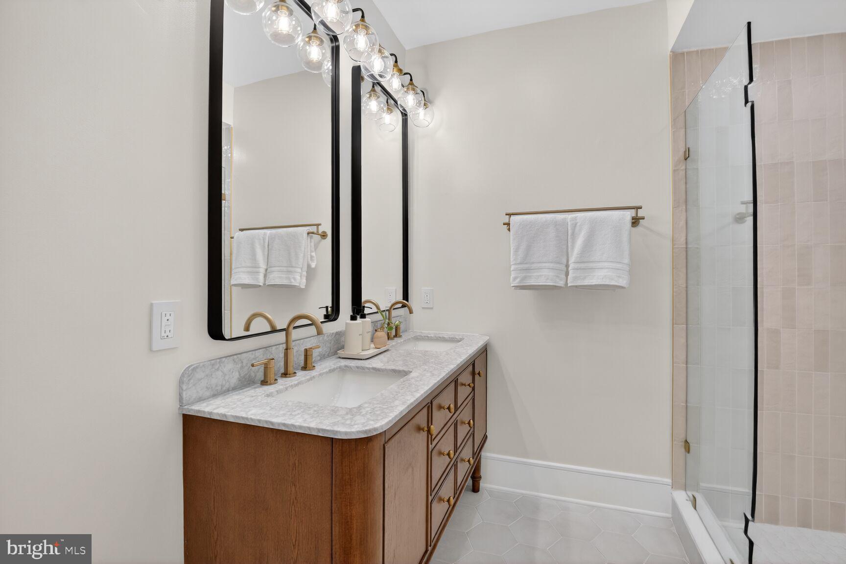 2524 41st Street Northwest, Unit 2 Washington, DC 20007 - Photo 22 of 27 a bathroom with a sink and a mirror