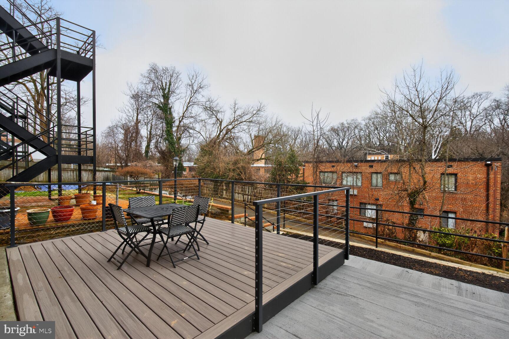 2524 41st Street Northwest, Unit 2 Washington, DC 20007 - Photo 26 of 27 a view of a roof deck with wooden floor and outdoor seating