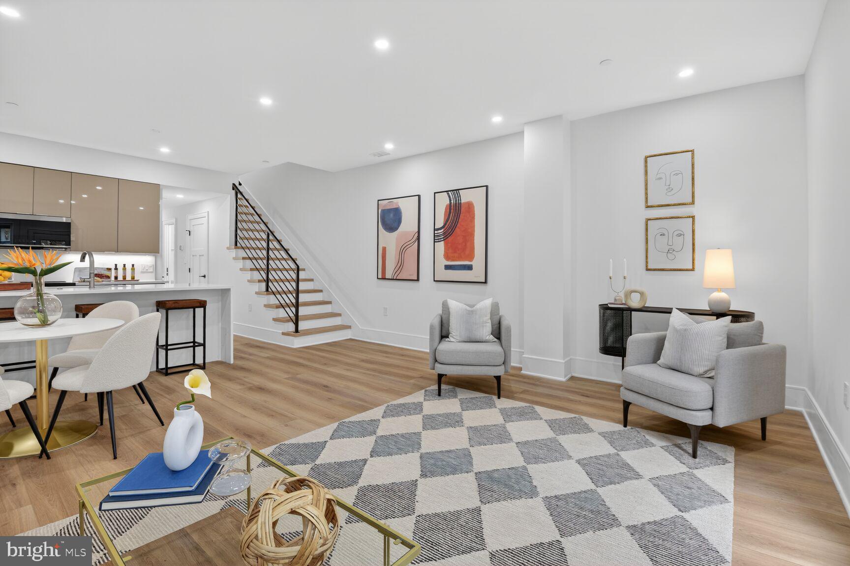 2524 41st Street Northwest, Unit 2 Washington, DC 20007 - Photo 3 of 27 a living room with furniture and a dining table with wooden floor