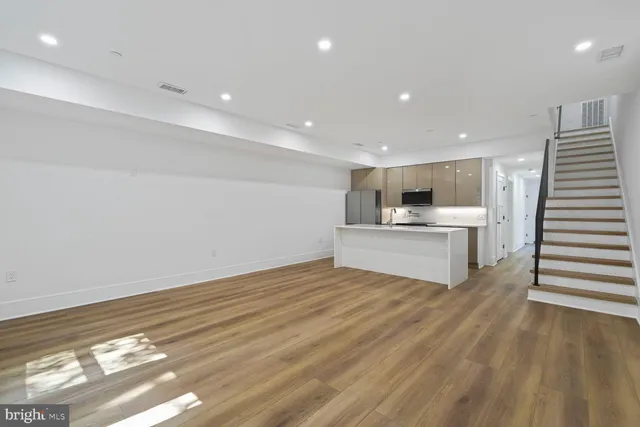 a view of kitchen with wooden floor