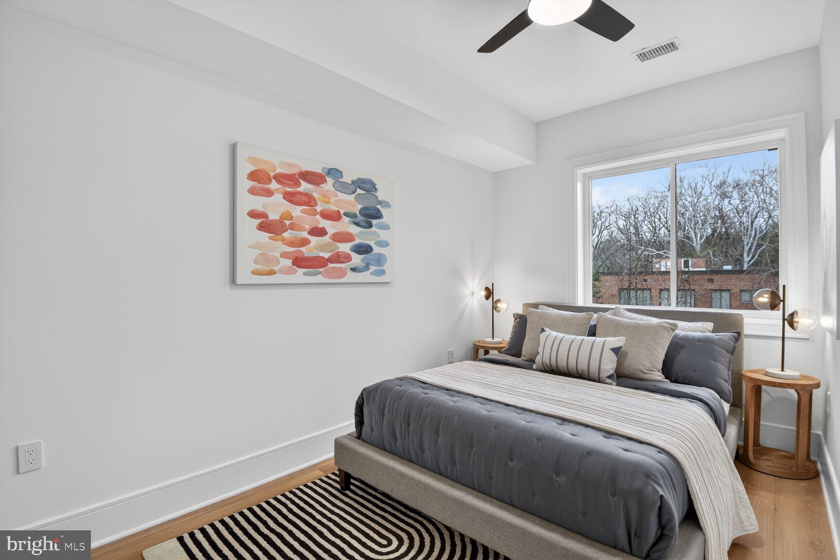 2524 41st Street Northwest, Unit 2 Washington, DC 20007 - Photo 10 of 27 a bedroom with a large bed and a window