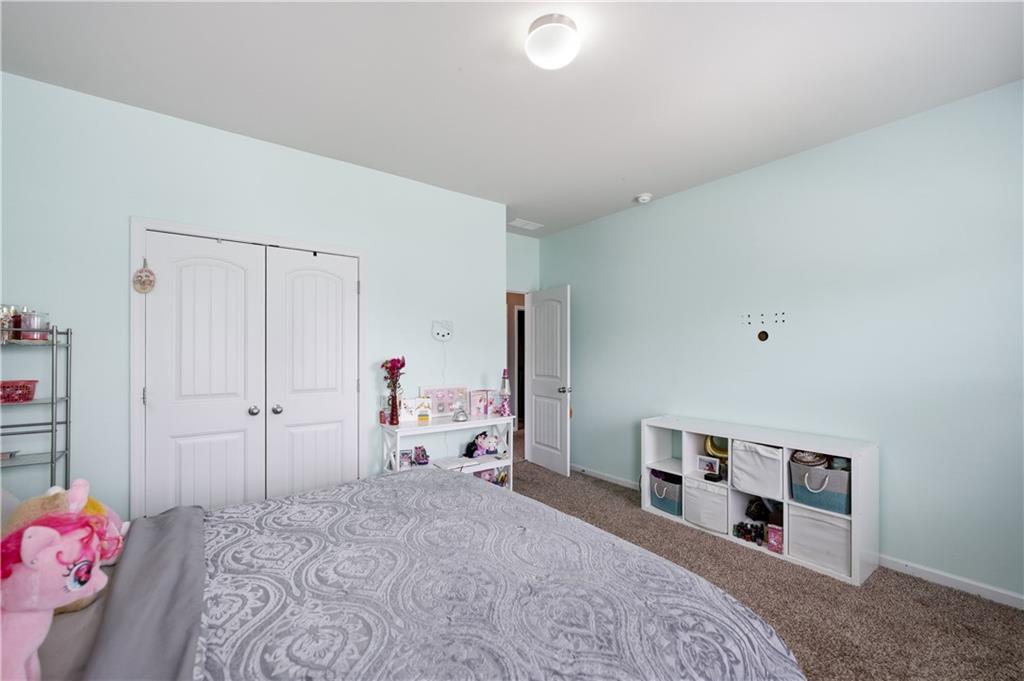 291 Boulder Run Hiram, GA 30141 - Photo 26 of 46 a bedroom with a bed and a dresser