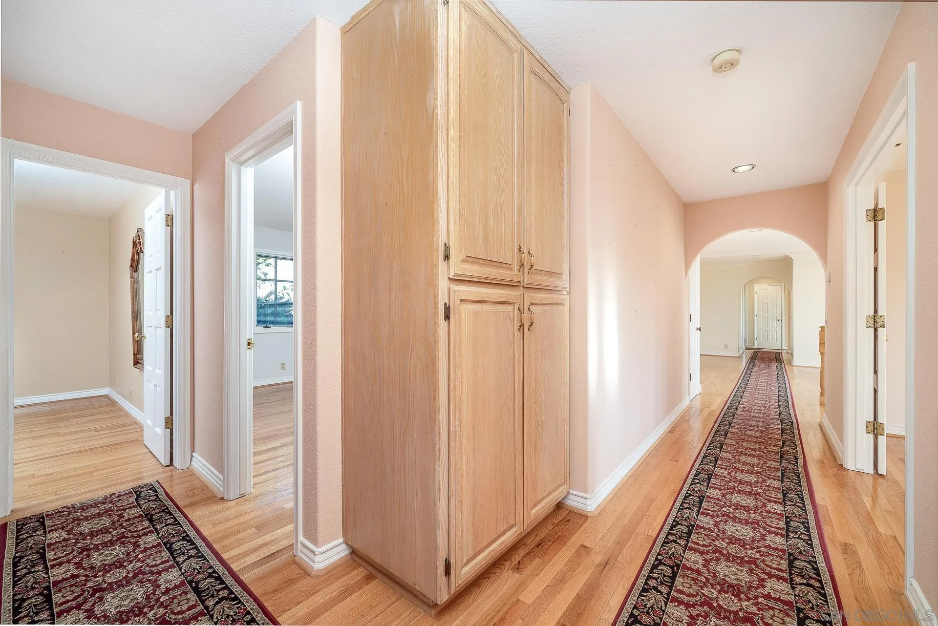 2908 Lakemont Drive Fallbrook, CA 92028 - Photo 19 of 70 a view of a hallway with wooden floor and staircase