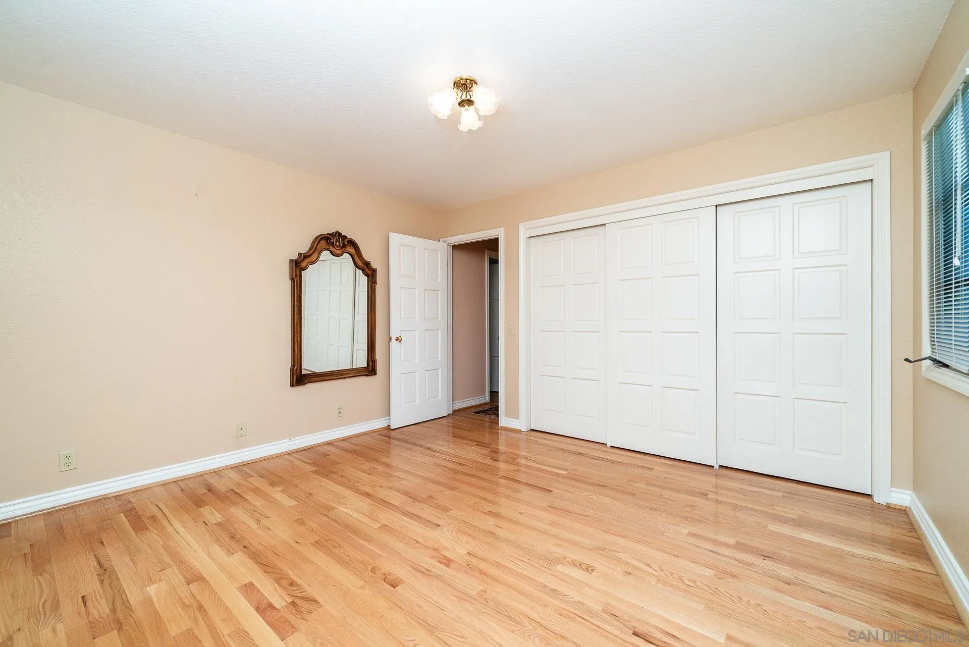 2908 Lakemont Drive Fallbrook, CA 92028 - Photo 23 of 70 a view of empty room with wooden floor and fan