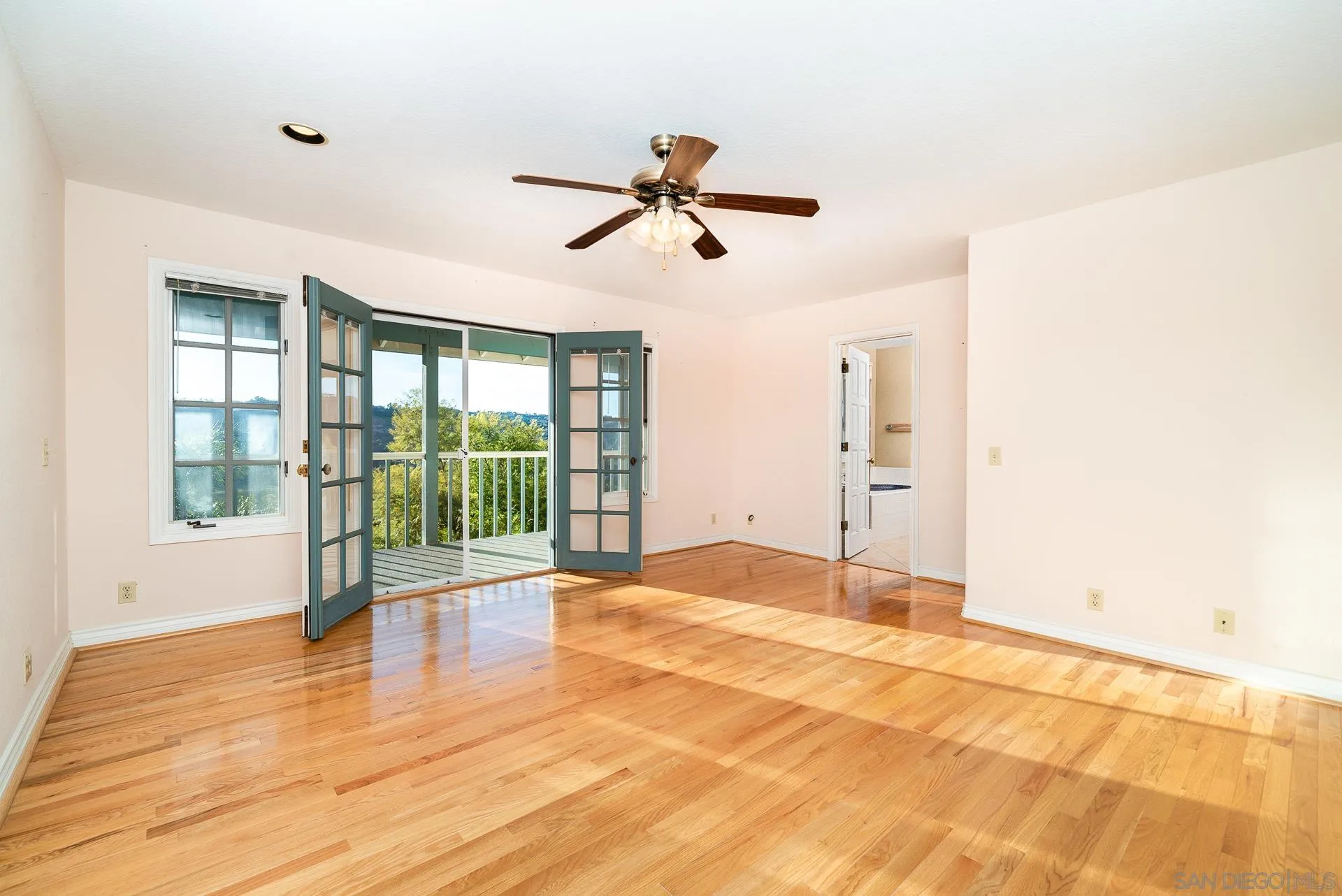 2908 Lakemont Drive Fallbrook, CA 92028 - Photo 26 of 70 a view of empty room with wooden floor and fan