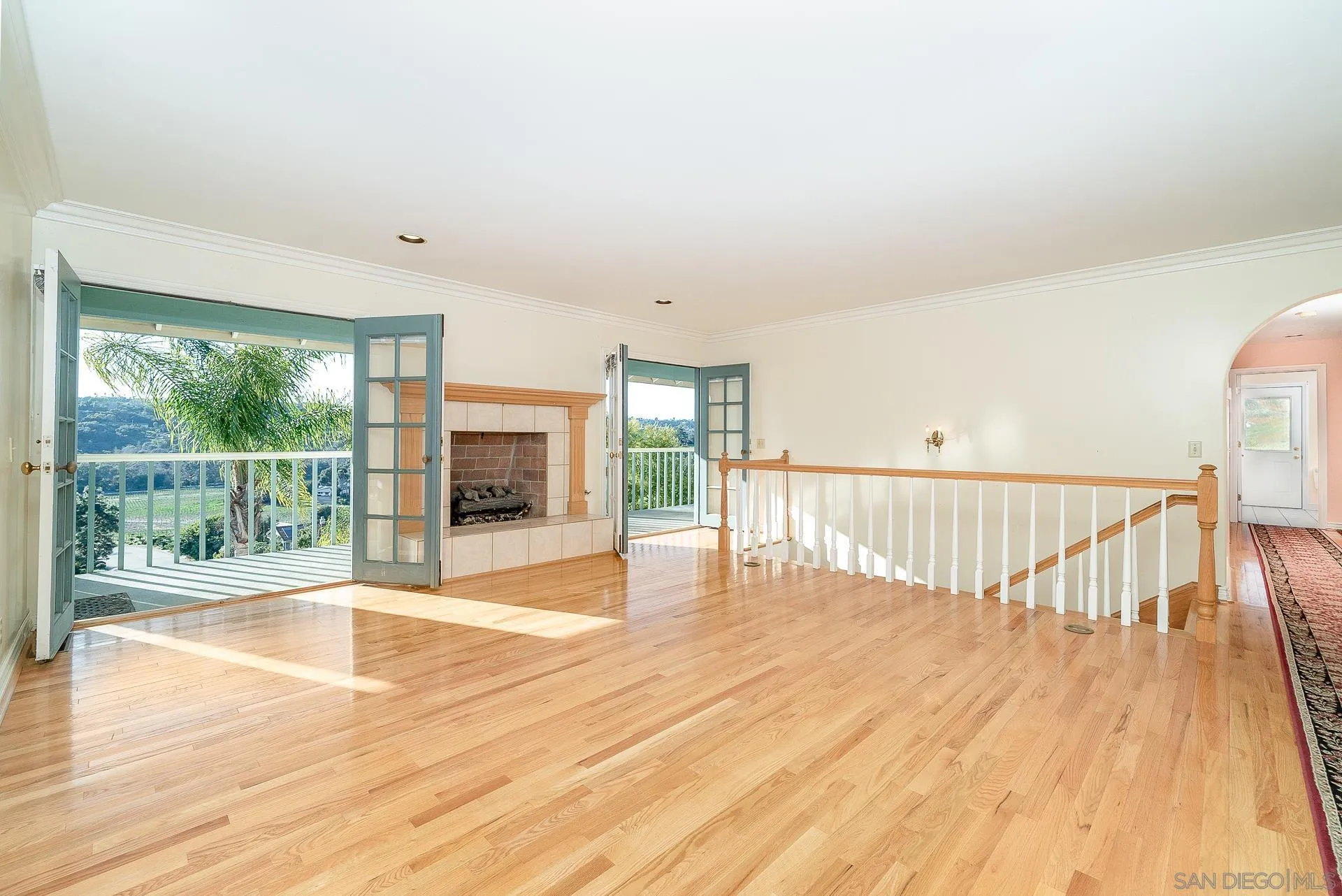 2908 Lakemont Drive Fallbrook, CA 92028 - Photo 4 of 70 a view of an empty room with wooden floor and a window