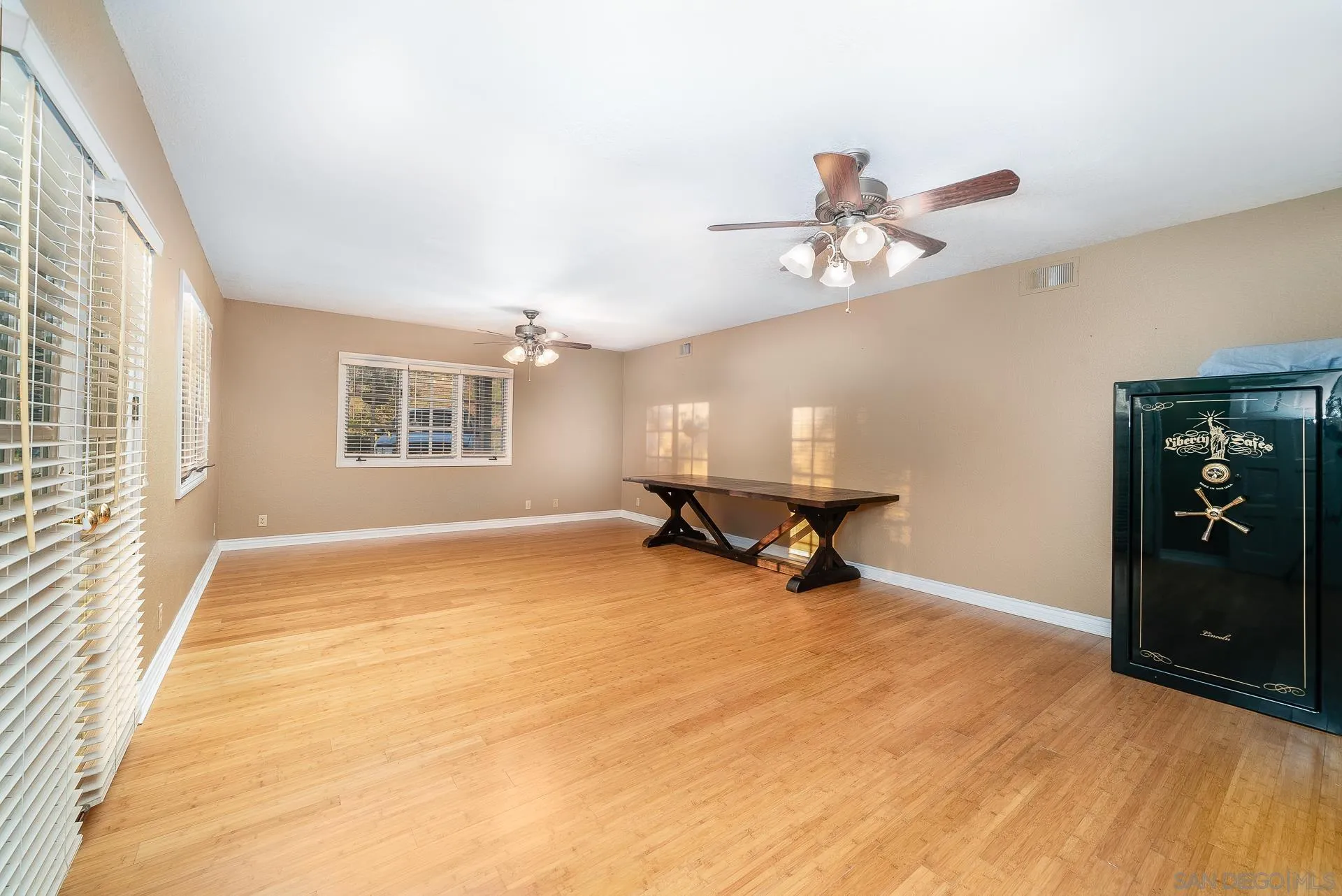 2908 Lakemont Drive Fallbrook, CA 92028 - Photo 41 of 70 a view of a livingroom with a piano and wooden floor
