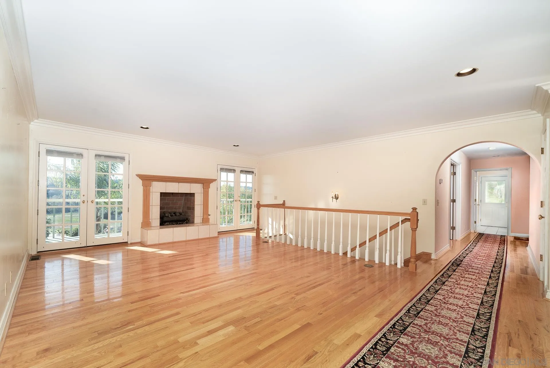 2908 Lakemont Drive Fallbrook, CA 92028 - Photo 5 of 70 a view of an empty room with wooden floor and a window