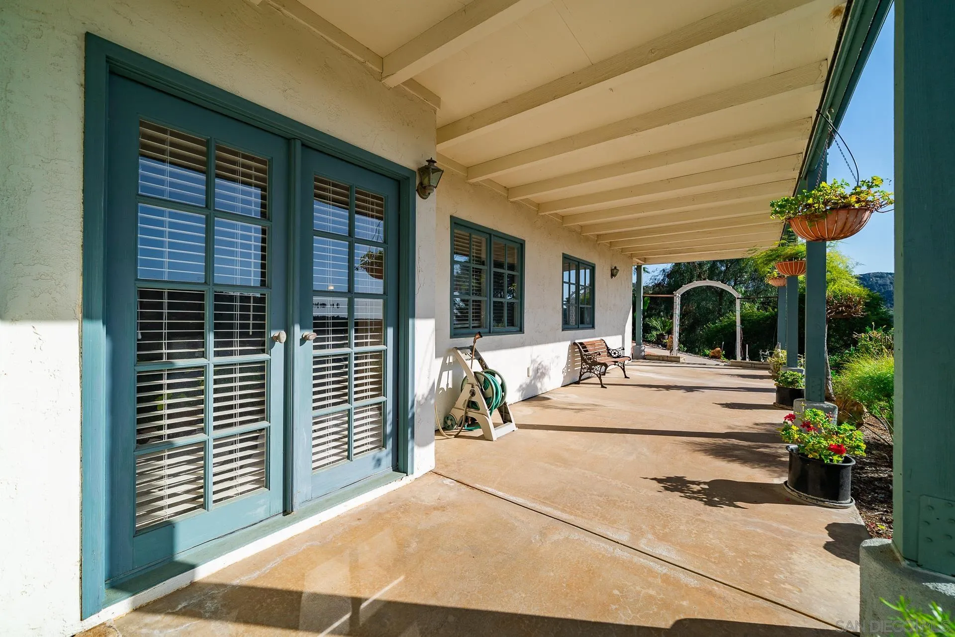 2908 Lakemont Drive Fallbrook, CA 92028 - Photo 53 of 70 a view of the patio with couches and table and chairs with wooden floor and fence