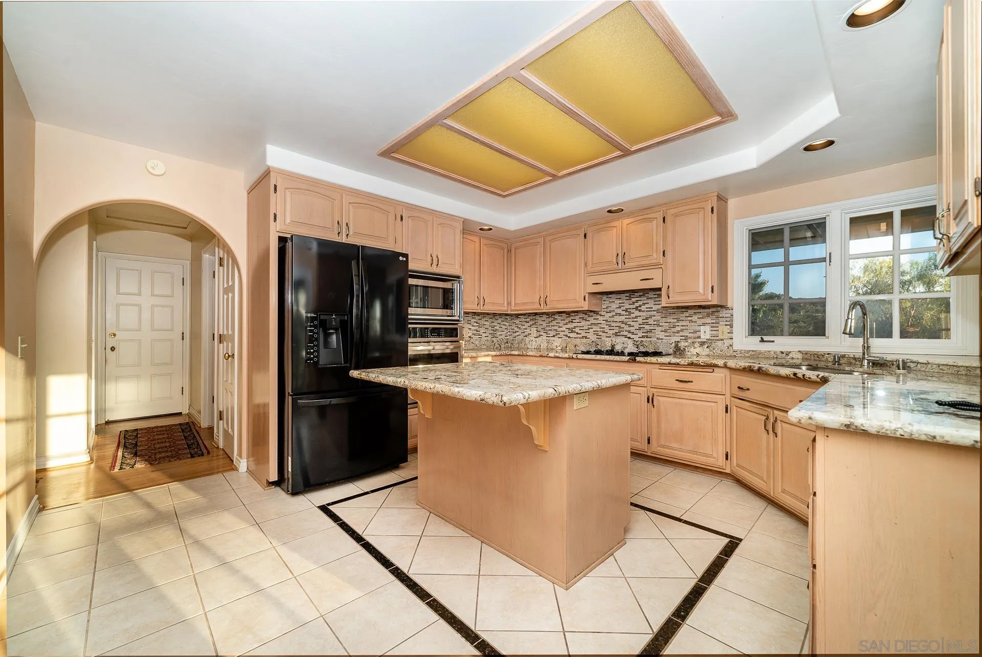 2908 Lakemont Drive Fallbrook, CA 92028 - Photo 7 of 70 a kitchen with stainless steel appliances granite countertop a refrigerator and a stove top oven