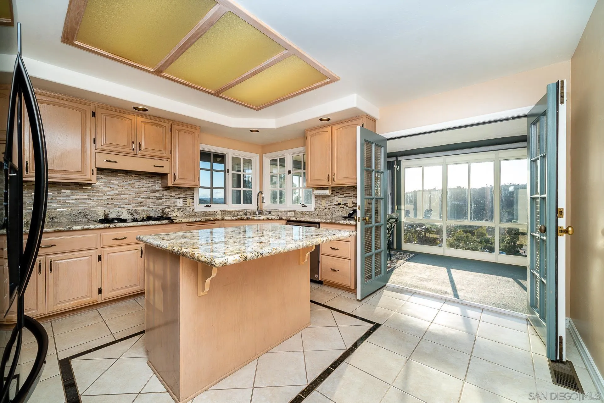 2908 Lakemont Drive Fallbrook, CA 92028 - Photo 8 of 70 a kitchen with stainless steel appliances granite countertop a stove a sink and a microwave