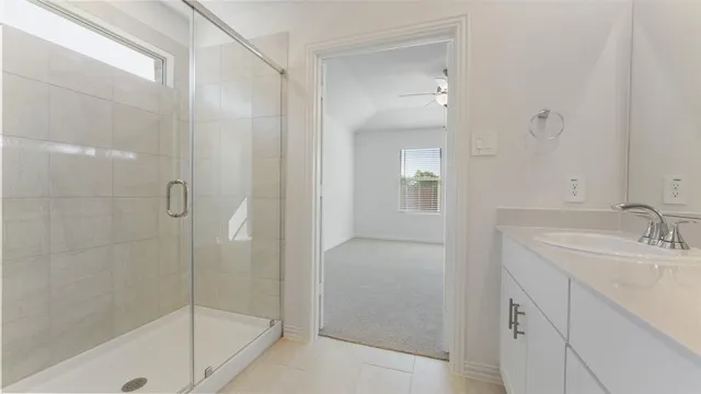 a bathroom with a shower and a sink