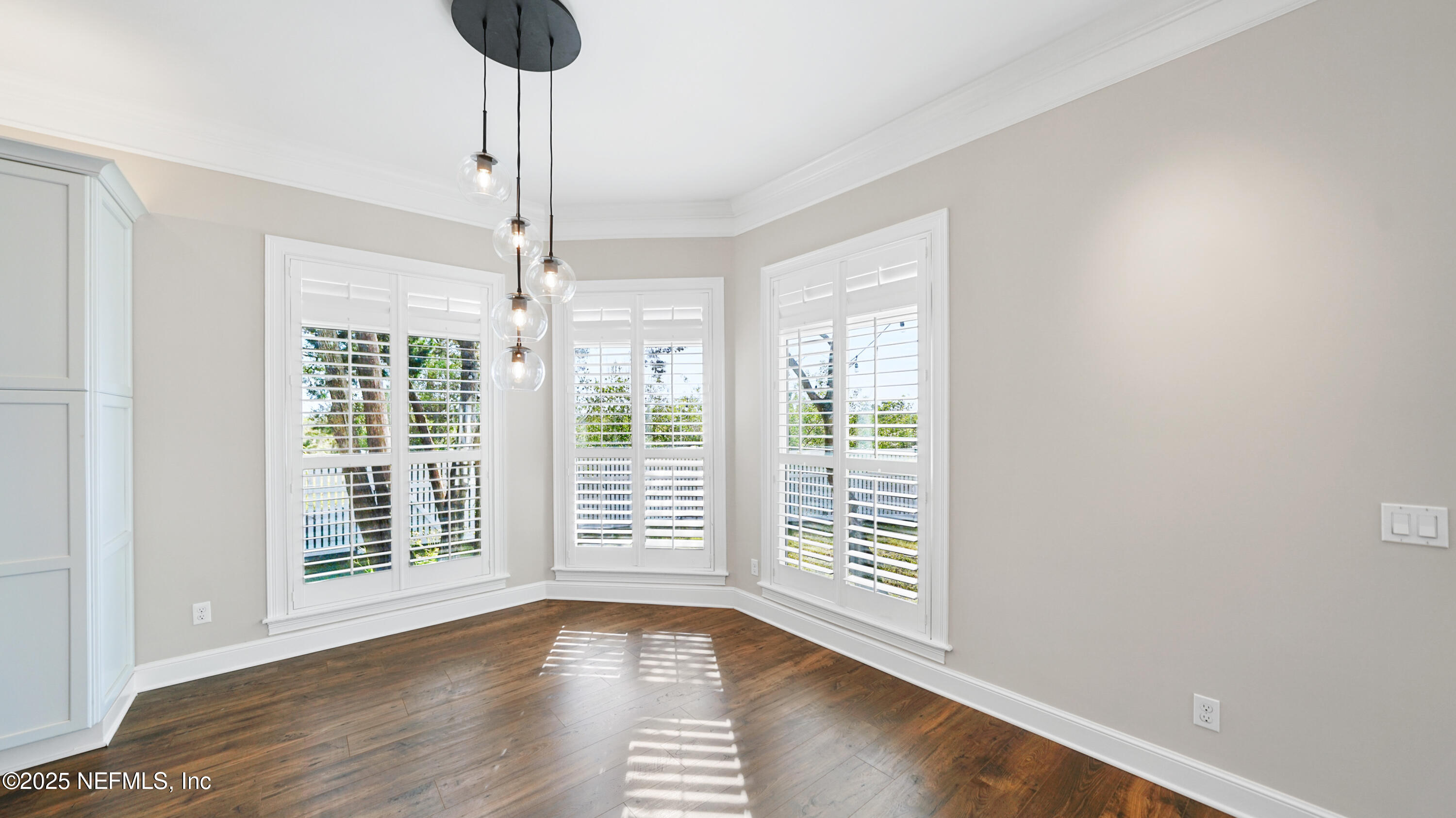 108 Spoonbill Point Court St. Augustine, FL 32080 - Photo 13 of 57 a view of an empty room with wooden floor and a window