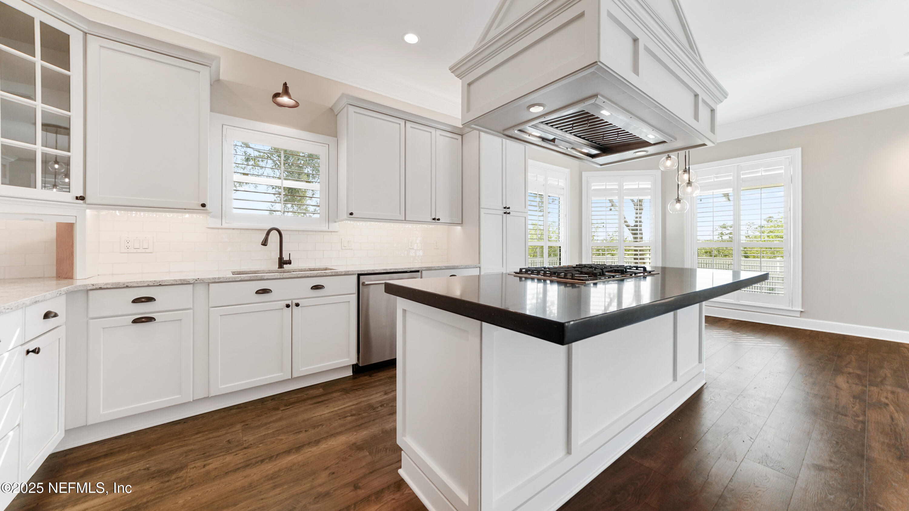 108 Spoonbill Point Court St. Augustine, FL 32080 - Photo 16 of 57 a kitchen with granite countertop a sink cabinets and wooden floor