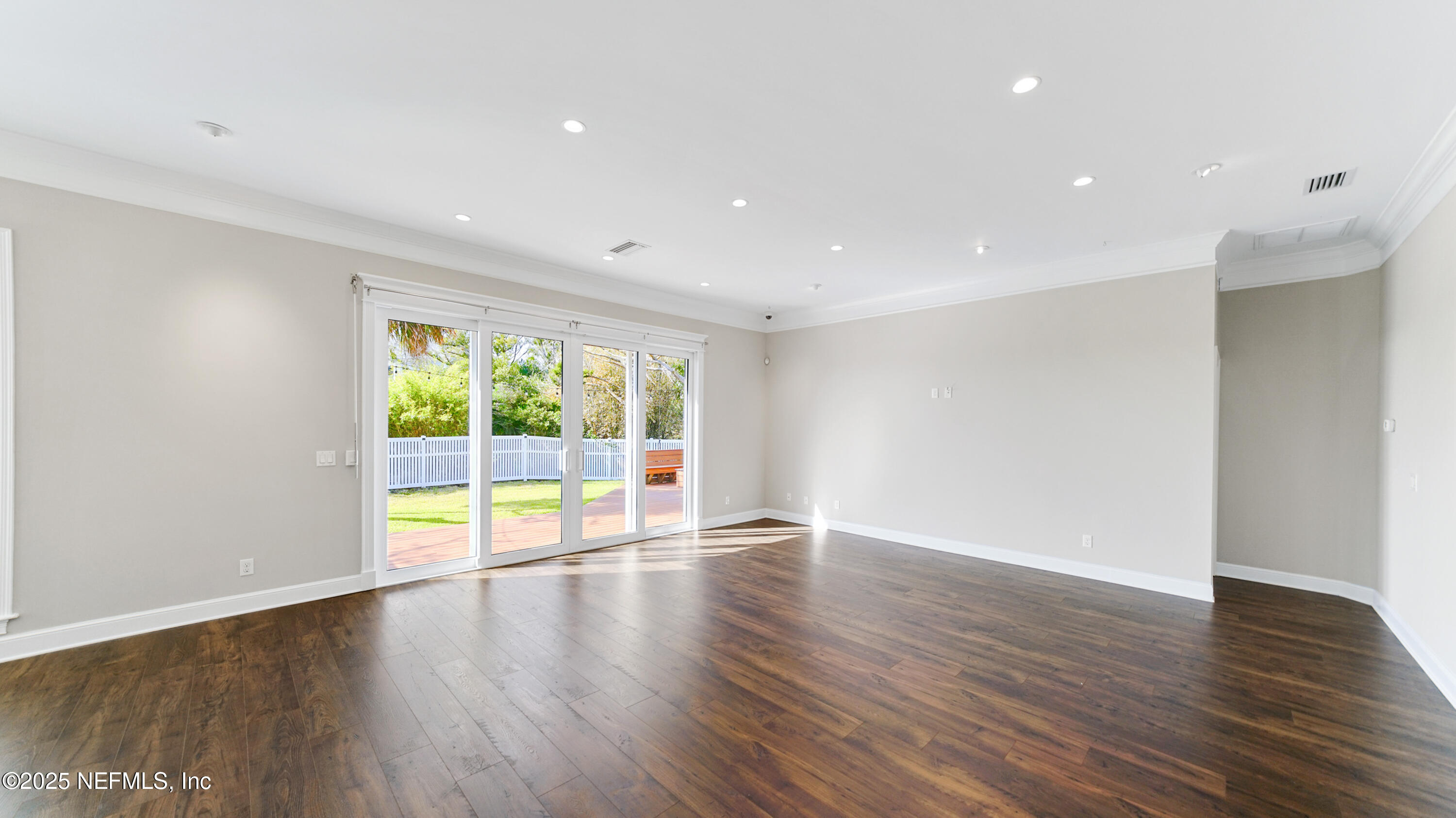 108 Spoonbill Point Court St. Augustine, FL 32080 - Photo 17 of 57 a view of an empty room with wooden floor and a window