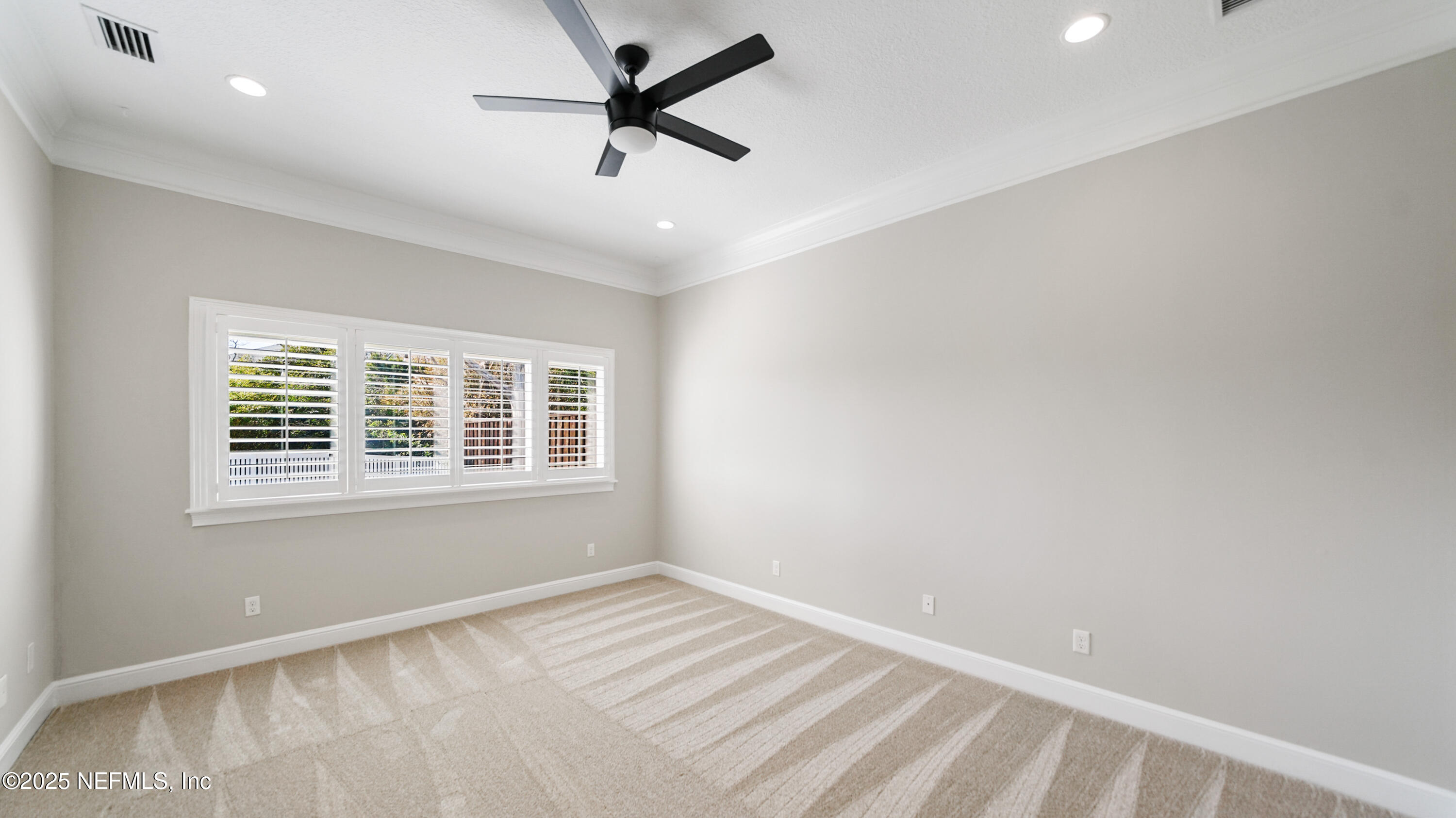 108 Spoonbill Point Court St. Augustine, FL 32080 - Photo 18 of 57 an empty room with a window and a ceiling fan