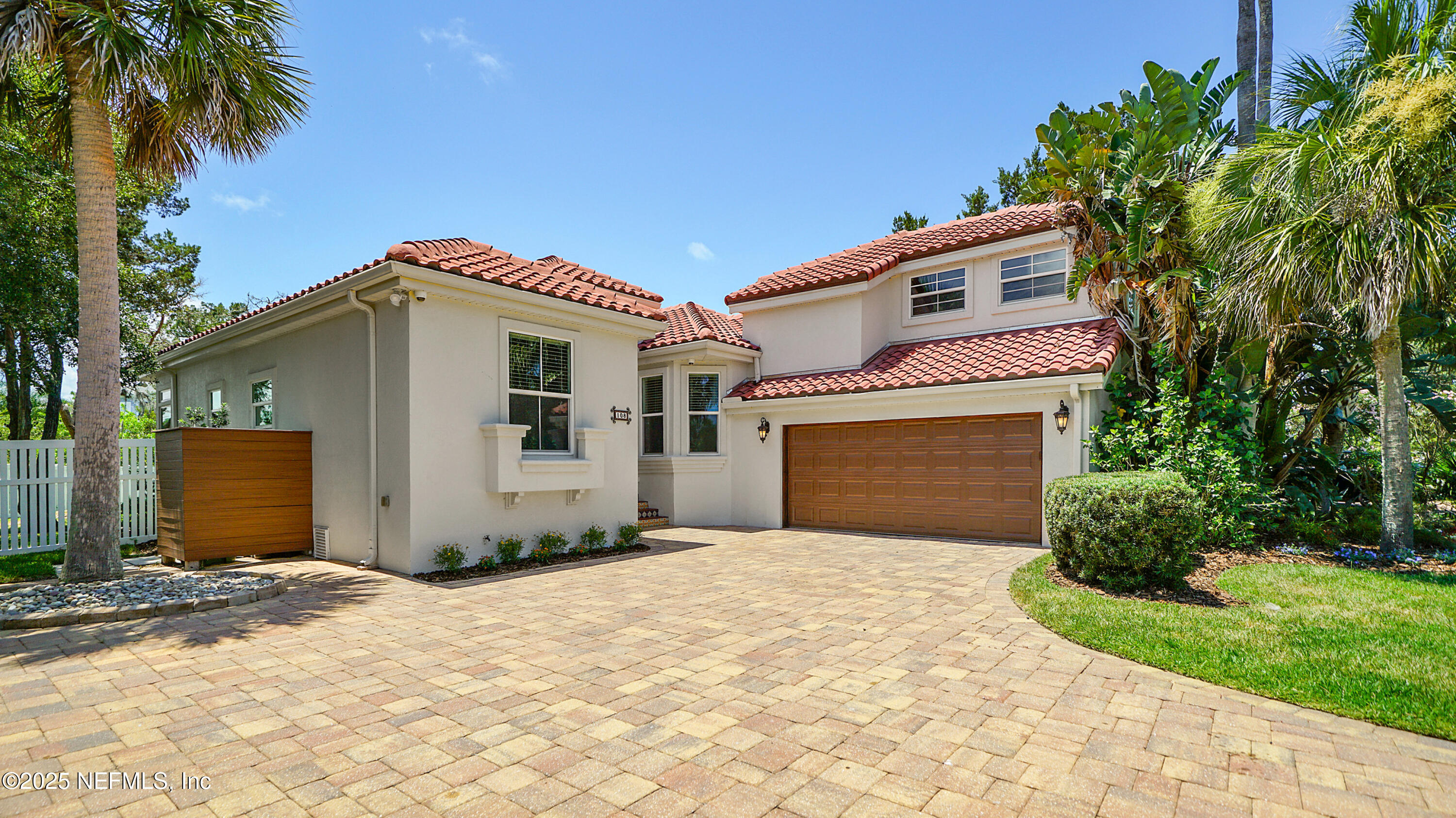 108 Spoonbill Point Court St. Augustine, FL 32080 - Photo 2 of 57 a front view of a house with a garden