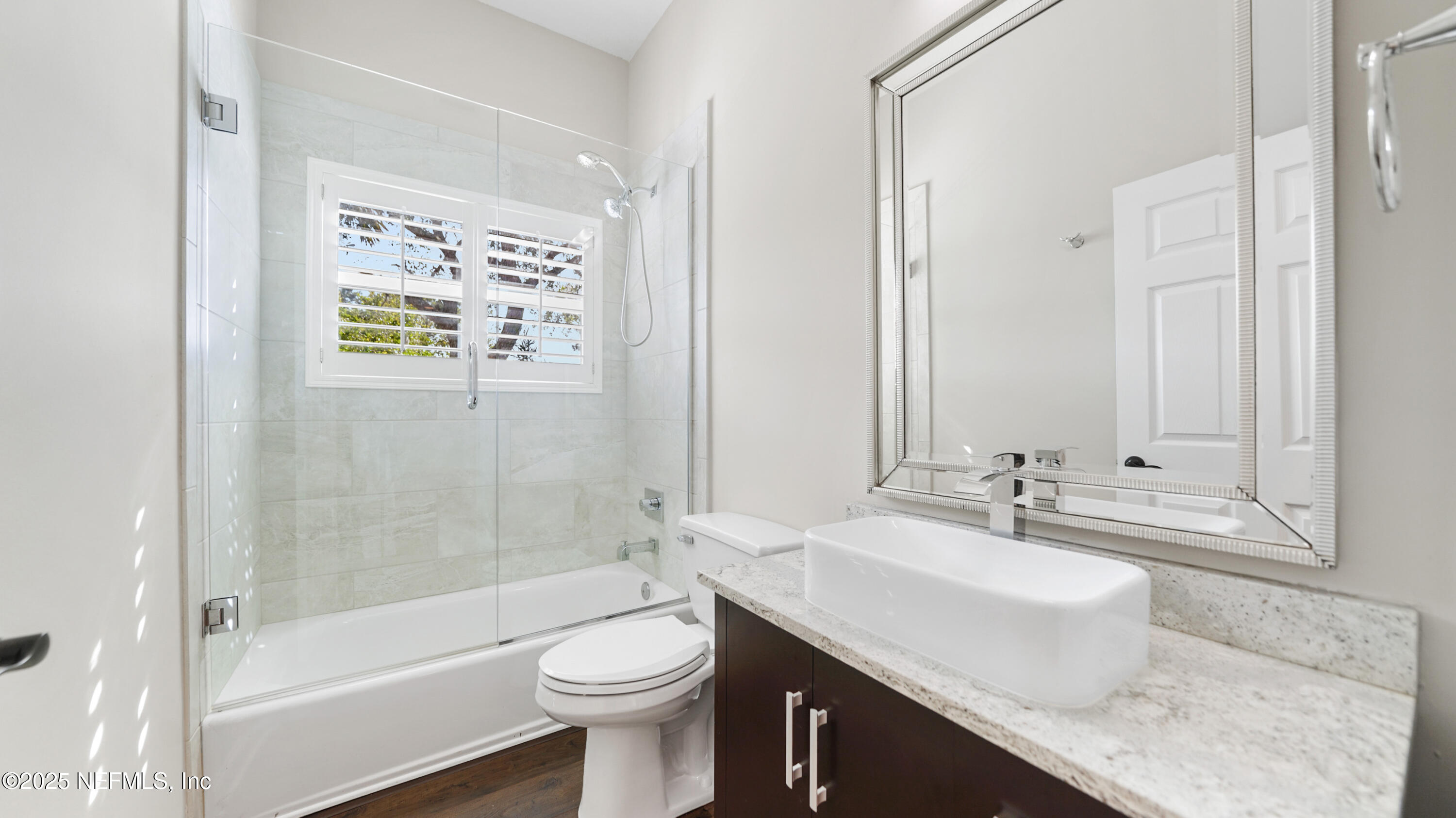 108 Spoonbill Point Court St. Augustine, FL 32080 - Photo 26 of 57 a bathroom with a granite countertop sink toilet and shower