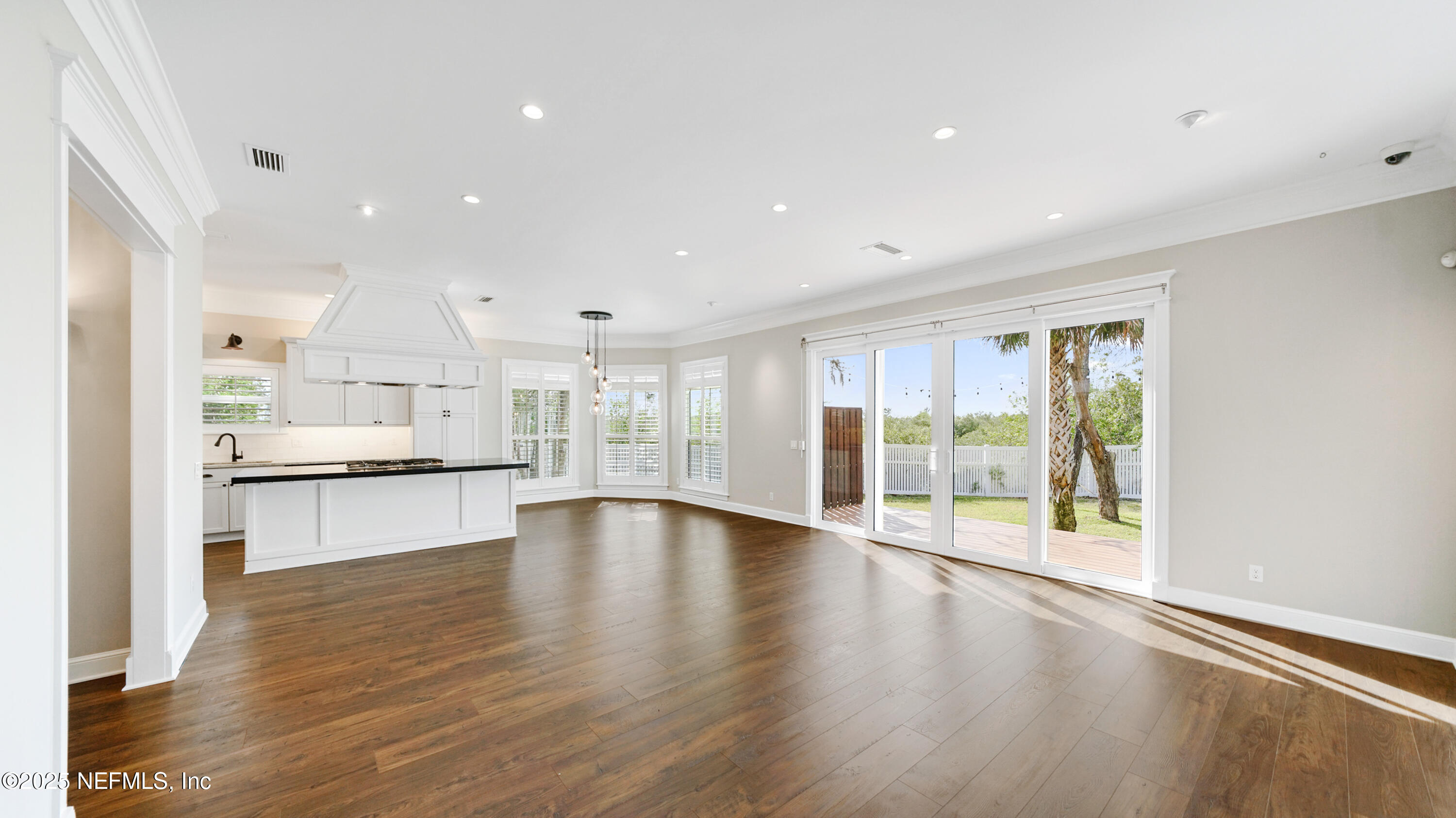 108 Spoonbill Point Court St. Augustine, FL 32080 - Photo 6 of 57 a large kitchen with stainless steel appliances granite countertop a large counter top and a wooden floors