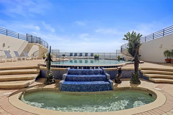a view of a swimming pool with a lounge chairs