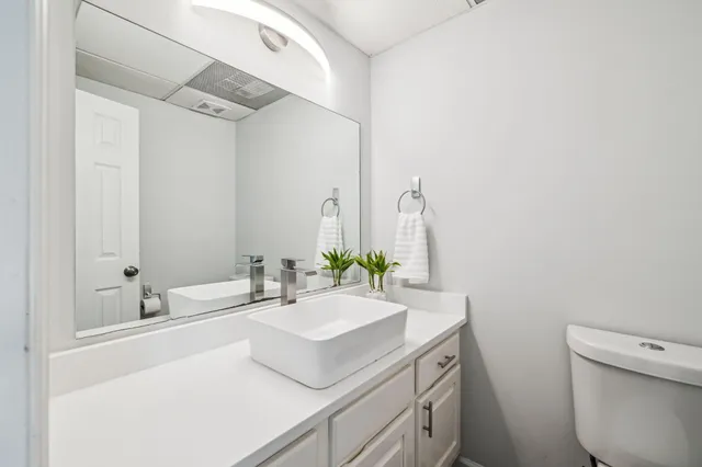 a kitchen with stainless steel appliances a sink dishwasher stove microwave and refrigerator