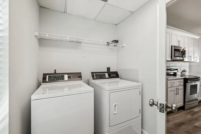 a kitchen with stainless steel appliances a stove a sink and a microwave