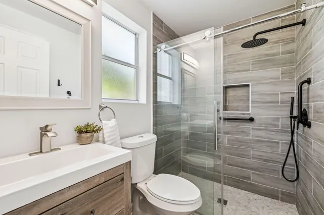 a view of a lake with houses in the back