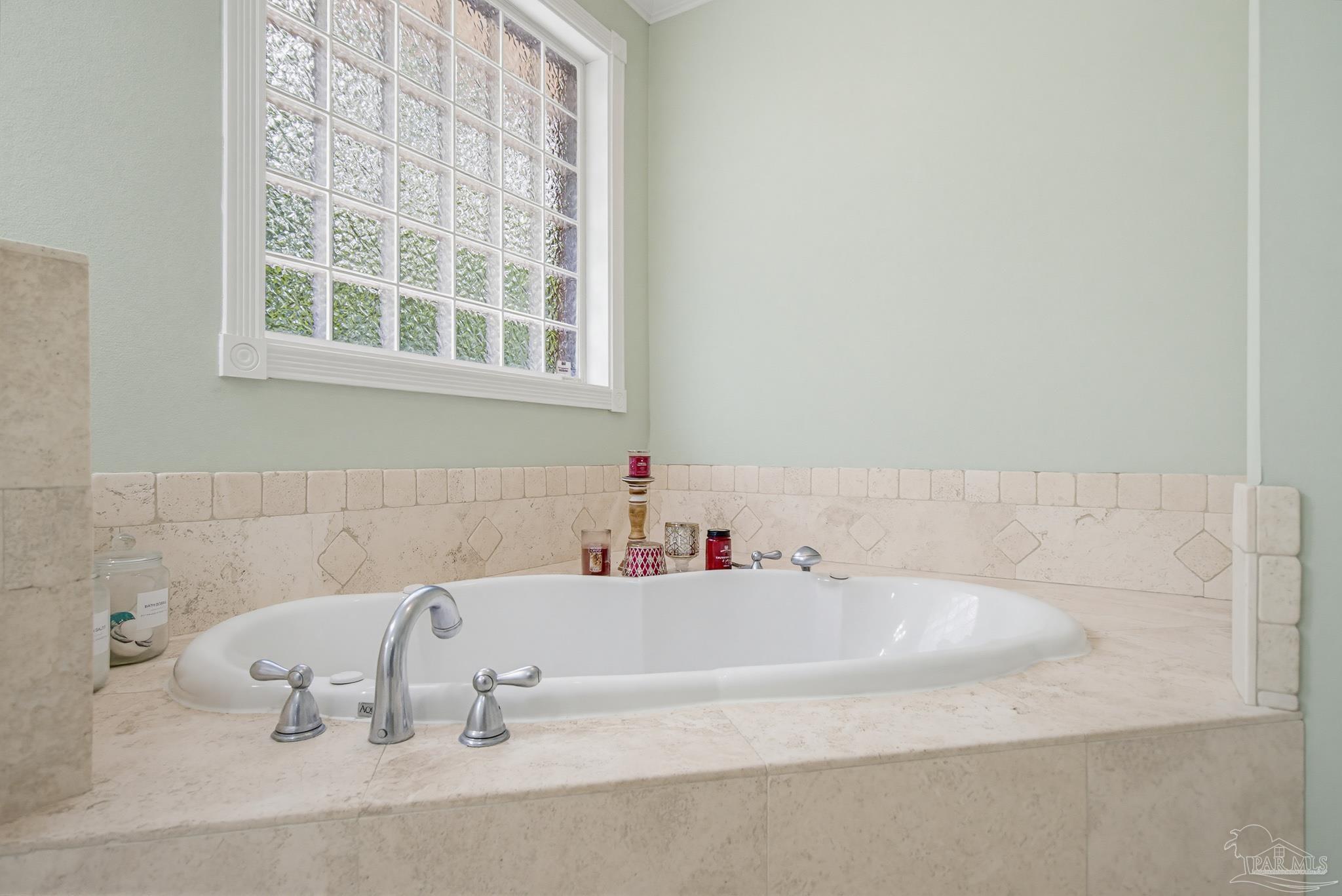2855 Walling Road Milton, FL 32570 - Photo 32 of 55 a bathroom with a bathtub and a sink