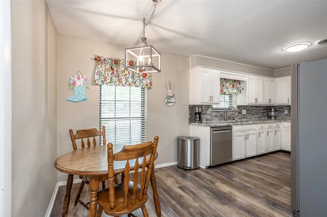 a dining room with furniture and window