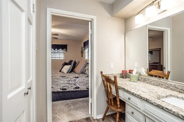 a bed room with a bed and a chair