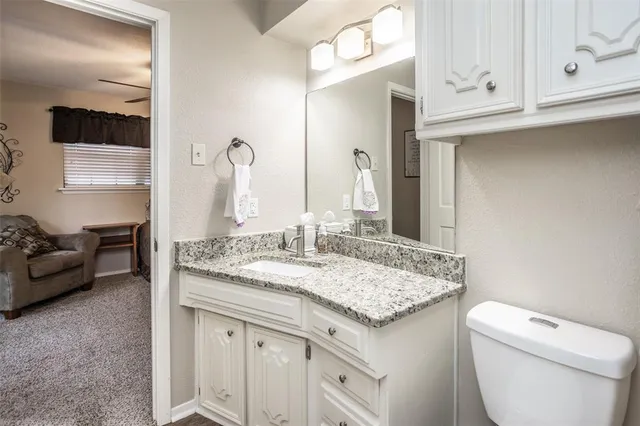 a bathroom with a shower and toilet