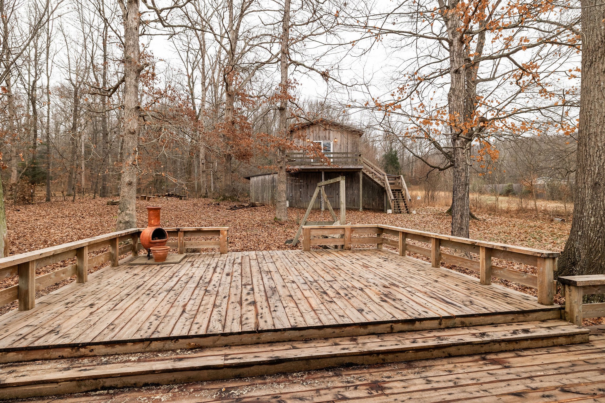 1826 New Hope Road Joelton, TN 37080 - Photo 52 of 95 a view of a roof deck with two couches and wooden floor