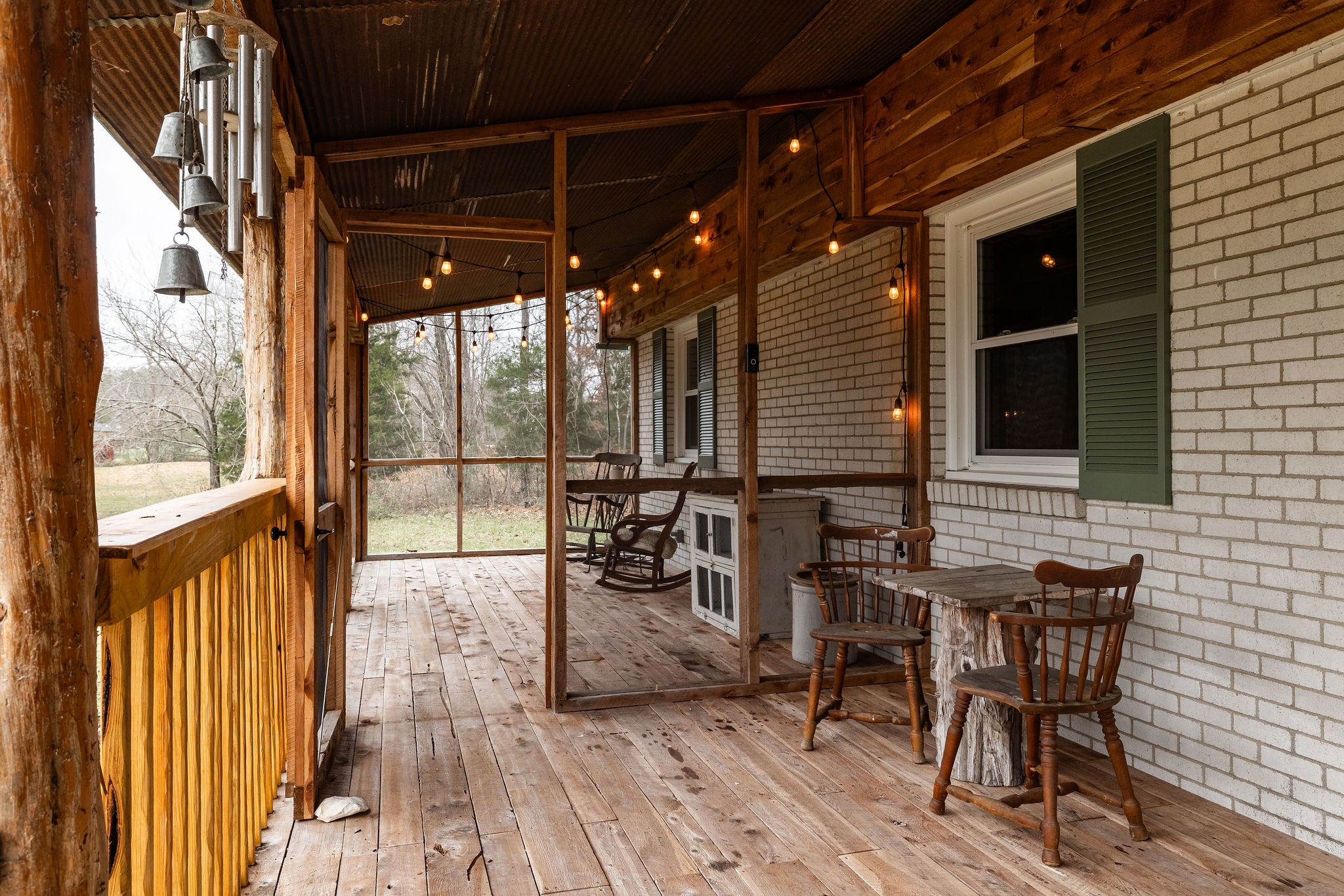 1826 New Hope Road Joelton, TN 37080 - Photo 8 of 95 a view of a porch with furniture and wooden floor