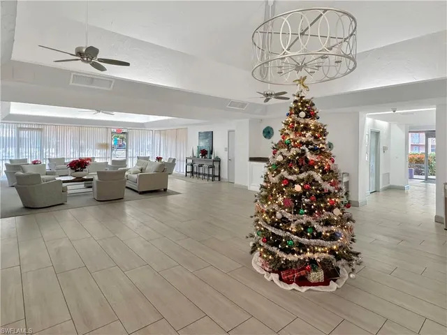 a very nice looking room with a large window and chandelier