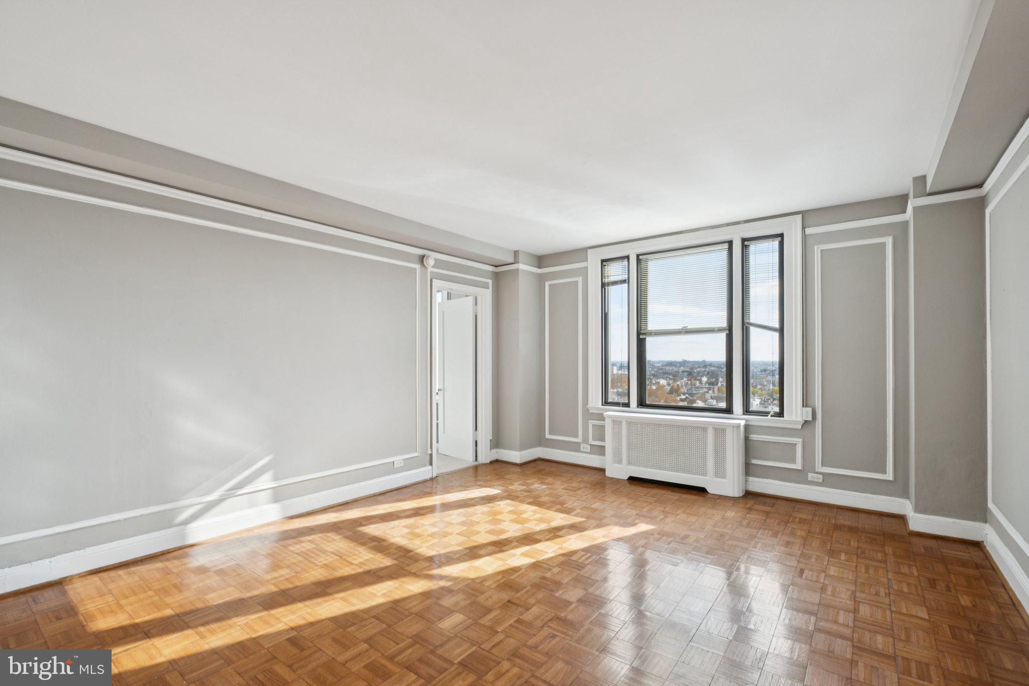 a view of an empty room with a window