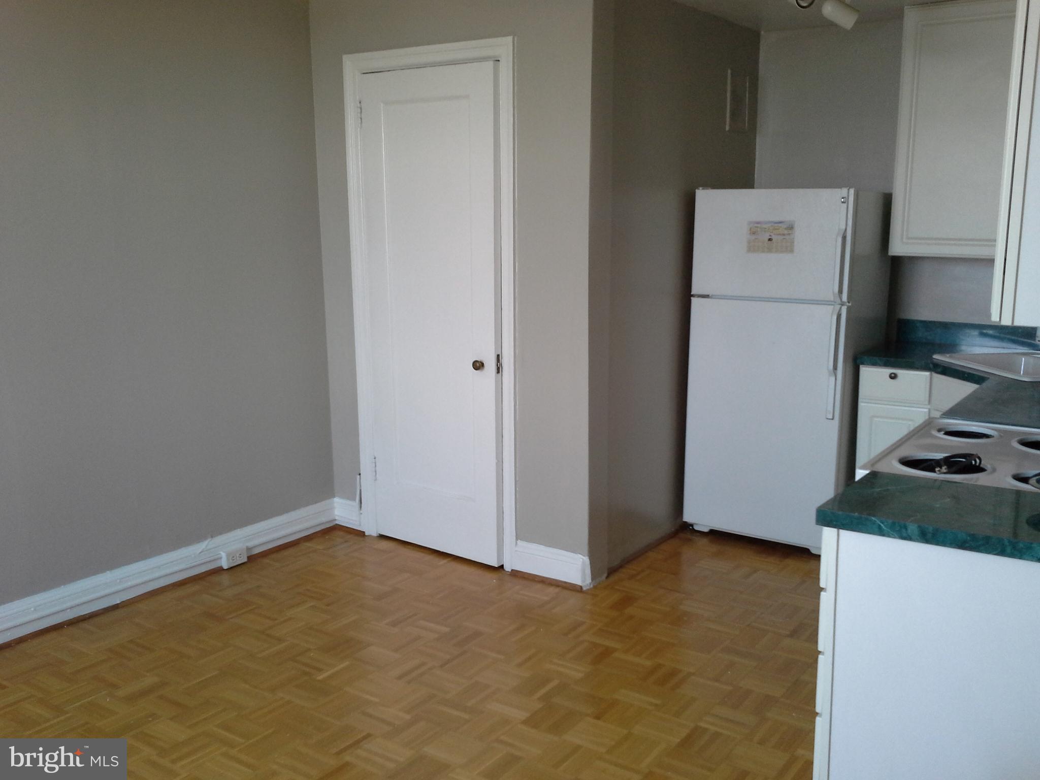 2031 Locust Street, Unit 1402 Philadelphia, PA 19103 - Photo 4 of 15 a view of kitchen and utility room