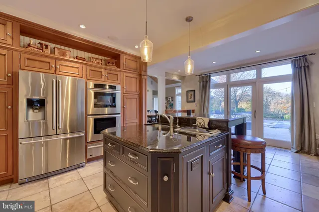 a view of a dining room with furniture and a window