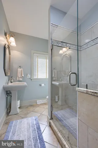 a spacious bedroom with a bed and a couch